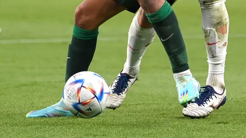 Players fight for the ball at the World Cup