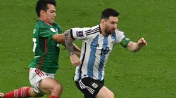 Hirving Lozano (left) against Lionel Messi.