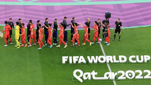 Players shake hands prior to the 2022 World Cup