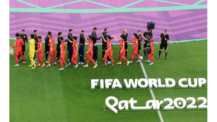 Players shake hands prior to the 2022 World Cup