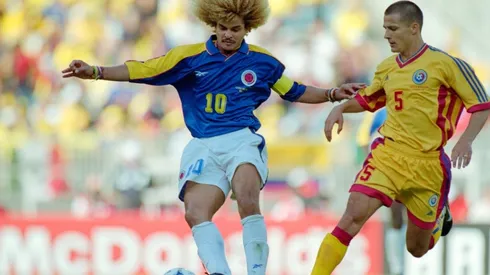 Colombia captain Carlos Valderrama (l) holds off the challenge of Constantin Galca of Romania during the 1998 FIFA World Cup Group match between Colombia and Romania on June 15, 1998 in Lyon, France.