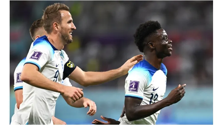 Bukayo Saka (R) of England celebrates scoring his team's fourth goal
