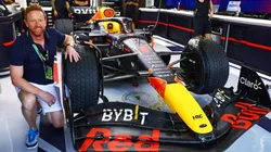 Paul Collingwood poses for a photo in the Red Bull Racing garage
