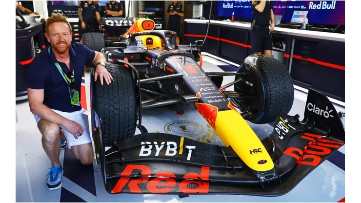 Paul Collingwood poses for a photo in the Red Bull Racing garage