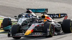 George Russell of Mercedes attacks Max Verstappen of Red Bull Racing