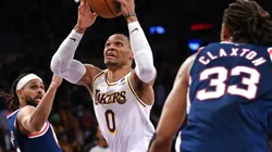 Russell Westbrook of the Los Angeles Lakers is defended by Patty Mills and Claxton of the Brooklyn Nets