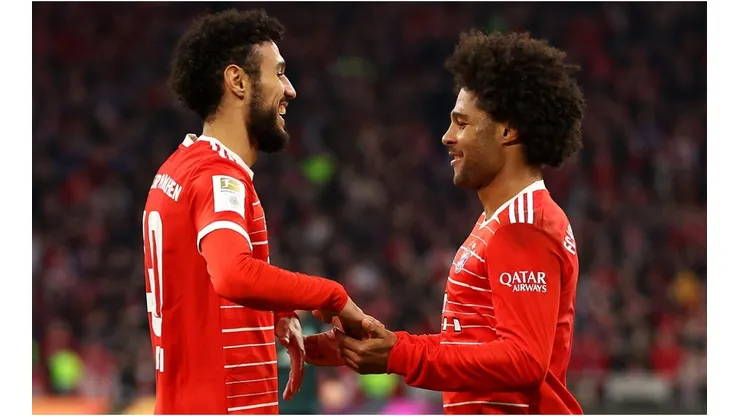 Serge Gnabry celebrates with Noussair Mazraoui of Bayern Munich
