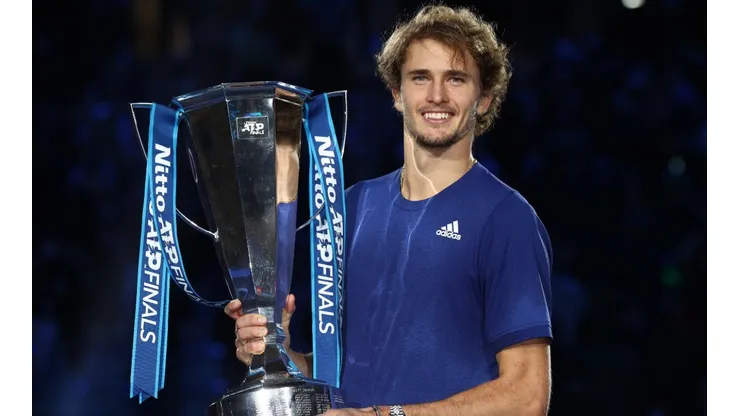 Alexander Zverev of Germany celebrates with the trophy of the 2021 ATP Finals