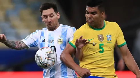 Messi (left) of Argentina fighting for ball control against Casemiro of Brazil
