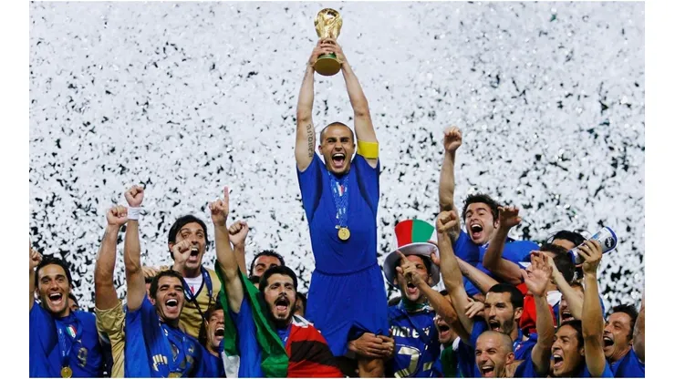The Italian players celebrate as Fabio Cannavaro of Italy lifts the World Cup trophy
