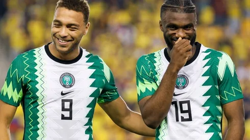 Cyriel Dessers (L) and Terem Moffi (R) of Nigeria laugh before a game against Ecuador