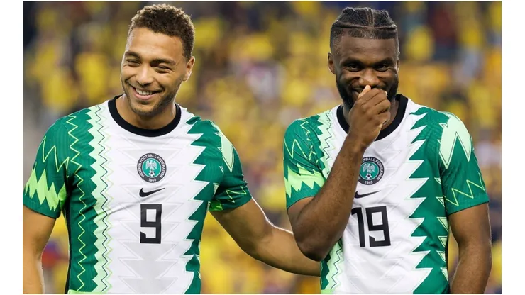 Cyriel Dessers (L) and Terem Moffi (R) of Nigeria laugh before a game against Ecuador