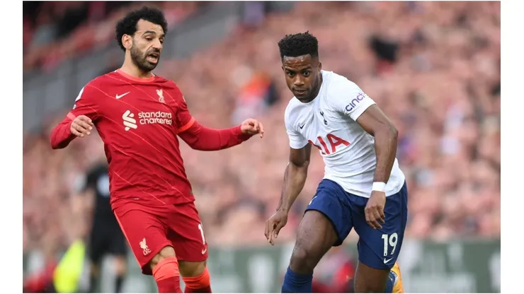 Ryan Sessegnon of Tottenham Hotspur runs with the ball under pressure from Mohamed Salah of Liverpool