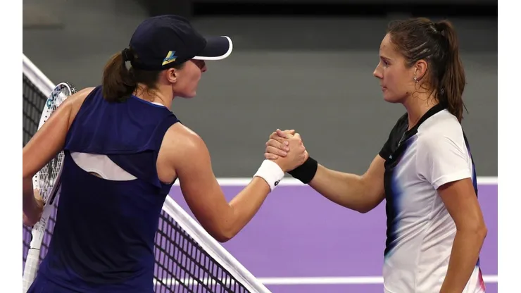 Iga Swiatek of Poland shakes hands with Daria Kasatkina of Russia after their matchup