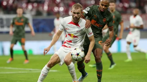 Konrad Laimer of RB Leipzig battles for possession with Lucas Taylor of Shakhtar Donetsk