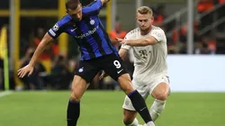 Edin Dzeko of FC Internazionale competes for the ball with Matthijs de Ligt of FC Bayern Munchen