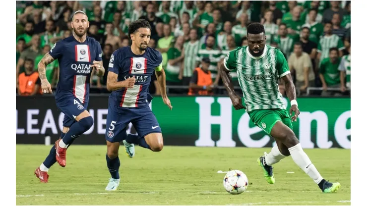 Frantzdy Pierrot of Maccabi Haifa FC competes for the ball with Marquinhos of Paris Saint Germain