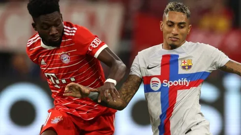 Alphonso Davies of Bayern Munich and Raphinha of FC Barcelona