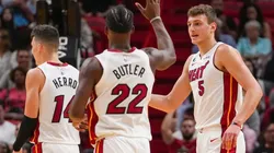 Nikola Jovic of the Miami Heat is congratulated by Jimmy Butler