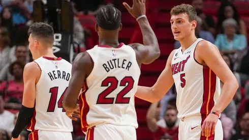 Nikola Jovic of the Miami Heat is congratulated by Jimmy Butler