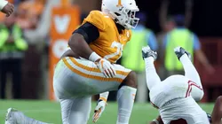 Omari Thomas of Tennessee tackles QB Bryce Young