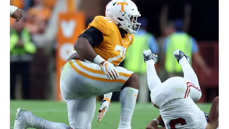 Omari Thomas of Tennessee tackles QB Bryce Young