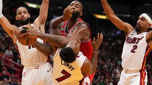 Andre Drummond of the Chicago Bulls fouls Kyle Lowry of the Miami Heat