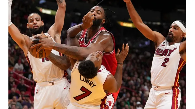Andre Drummond of the Chicago Bulls fouls Kyle Lowry of the Miami Heat