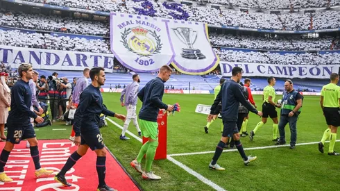 Barcelona players walk onto the pitch against Real Madrid
