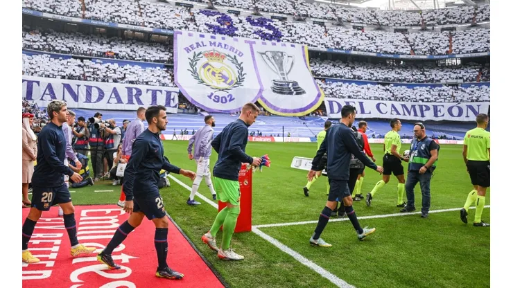 Barcelona players walk onto the pitch against Real Madrid