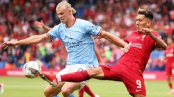 Erling Haaland of Manchester City and Roberto Firmino of Liverpool