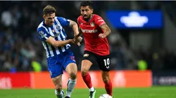 Kerem Demirbay of Bayer 04 Leverkusen battles for possession with Toni Martinez of FC Porto