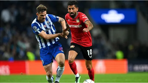 Kerem Demirbay of Bayer 04 Leverkusen battles for possession with Toni Martinez of FC Porto