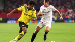 Karim Adeyemi of Borussia Dortmund battles for possession with Kike Salas of Sevilla FC