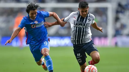Arturo González of Monterrey fights for the ball with José Rivero of Cruz Azul