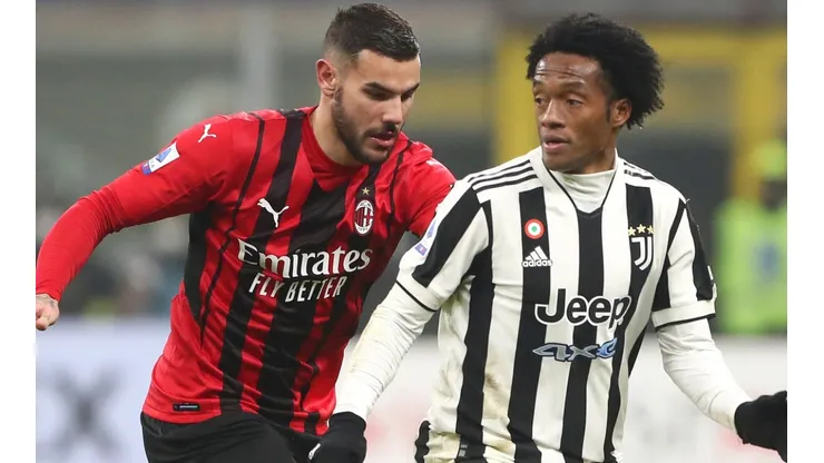Theo Hernandez of Milan and Juan Cuadrado of Juventus
