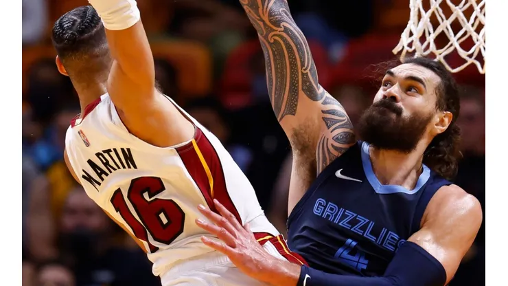 Caleb Martin of the Miami Heat and Steven Adams of the Memphis Grizzlies