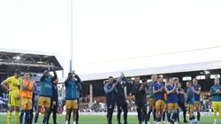 Players and staff of Newcastle United applaud fans after the Premier League match between Fulham FC and Newcastle United at Craven Cottage on October 01, 2022 in London, England.