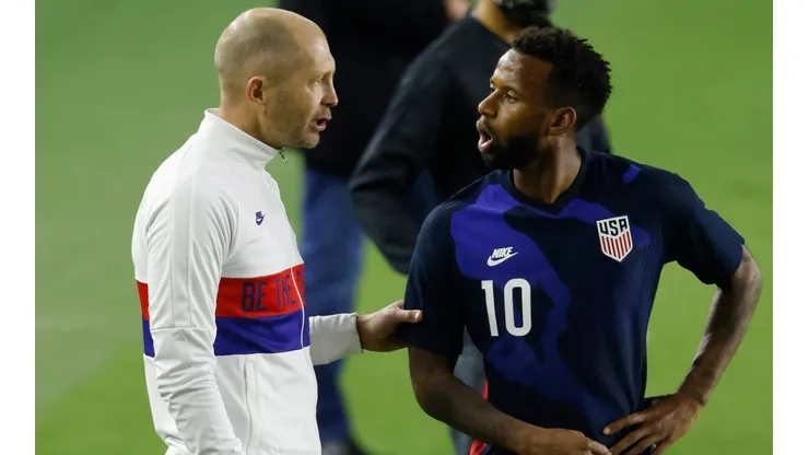Head coach Gregg Berhalter of the United States talks with Kellyn Acosta #10 against El Salvador during the second half at Inter Miami CF Stadium on December 09, 2020 in Fort Lauderdale, Florida.