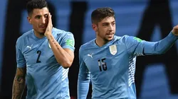 Federico Valverde with Jose Maria Gimenez of Uruguay