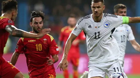 Marko Jankovic of Montenegro and Edin Dzeko of Bosnia and Herzegovina