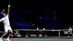 Roger Federer serves during a practice session