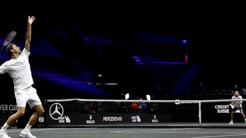 Roger Federer serves during a practice session