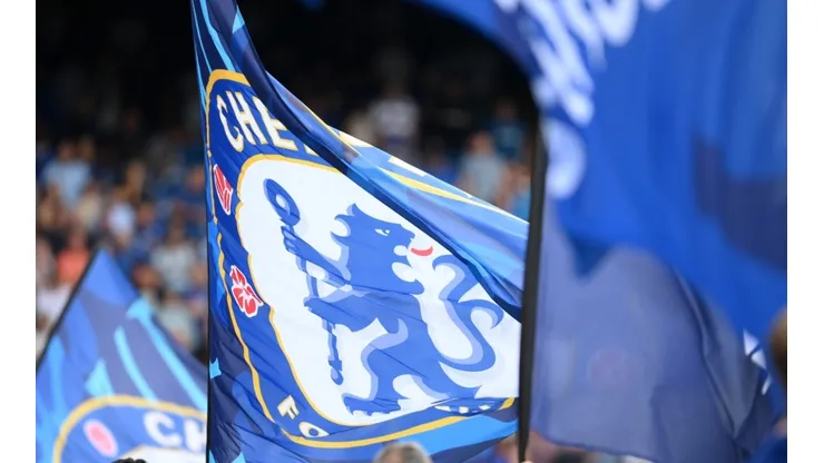 Chelsea fans wave flags prior to the Premier League match between Chelsea FC and West Ham United at Stamford Bridge on September 03, 2022 in London, England.