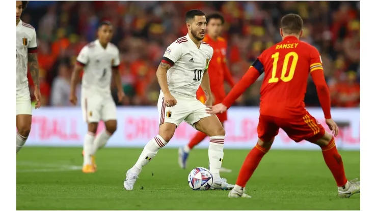 Eden Hazard of Belgium tracked by Aaron Ramsey of Wales