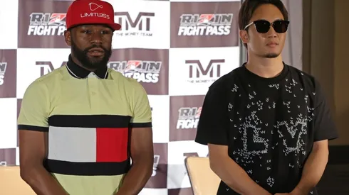 Boxer Floyd Mayweather Jr. (L) and mixed martial artist Mikuru Asakura