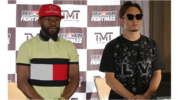 Boxer Floyd Mayweather Jr. (L) and mixed martial artist Mikuru Asakura