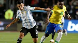 Lisandro Martínez of Argentina competes for the ball with Vinicius Junior of Brazil