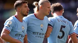 Ruben Dias, Erling Haaland, and John Stones of Manchester City
