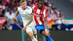 Toni Kroos of Real Madrid challenges Geoffrey Kondogbia of Atletico Madrid